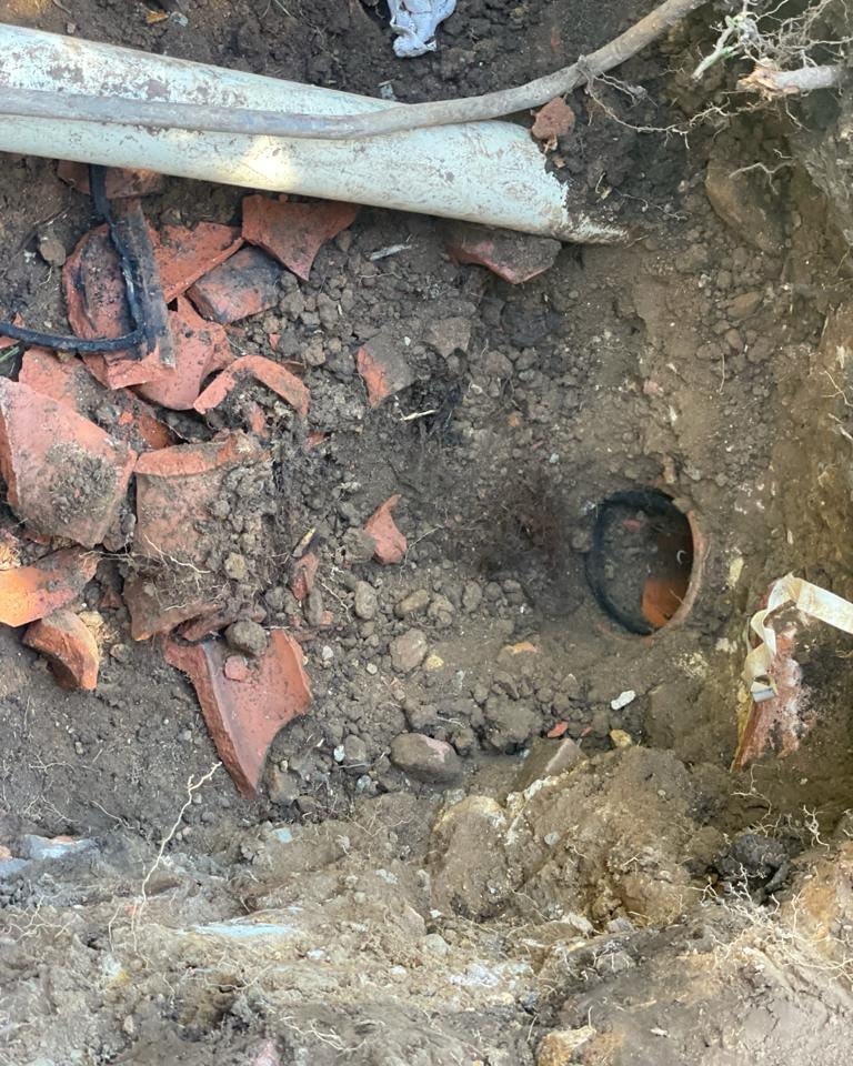 A licensed plumber in Nowra using a trenchless pipe relining method to fix damaged pipes without excavation.