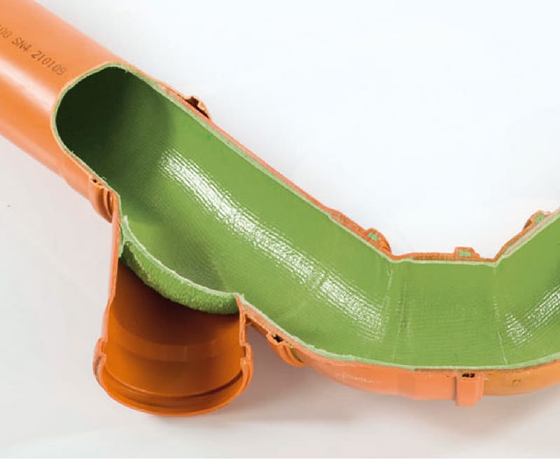 A close-up of a drain relining process in Nowra, showing epoxy resin being inserted into a damaged pipe.